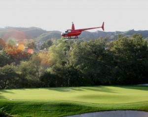 Over 500 golf balls drop onto the 18th green for the 2009 Helicopter Ball Drop
